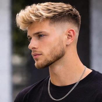 Low taper fade blonde hair with subtle fade on the sides and textured blonde top