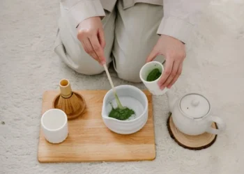 a person making traditional matcha tea