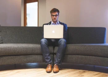 a man finding tips to build a business on laptop