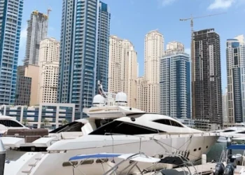 white yacht on body of water