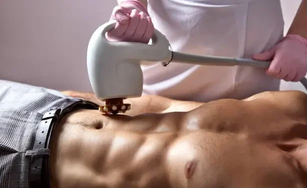 a doctor sculpting muscle of patient with machines