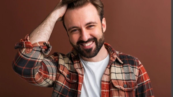 Portrait of sexy goodlooking attractive stylish bearded man on brown